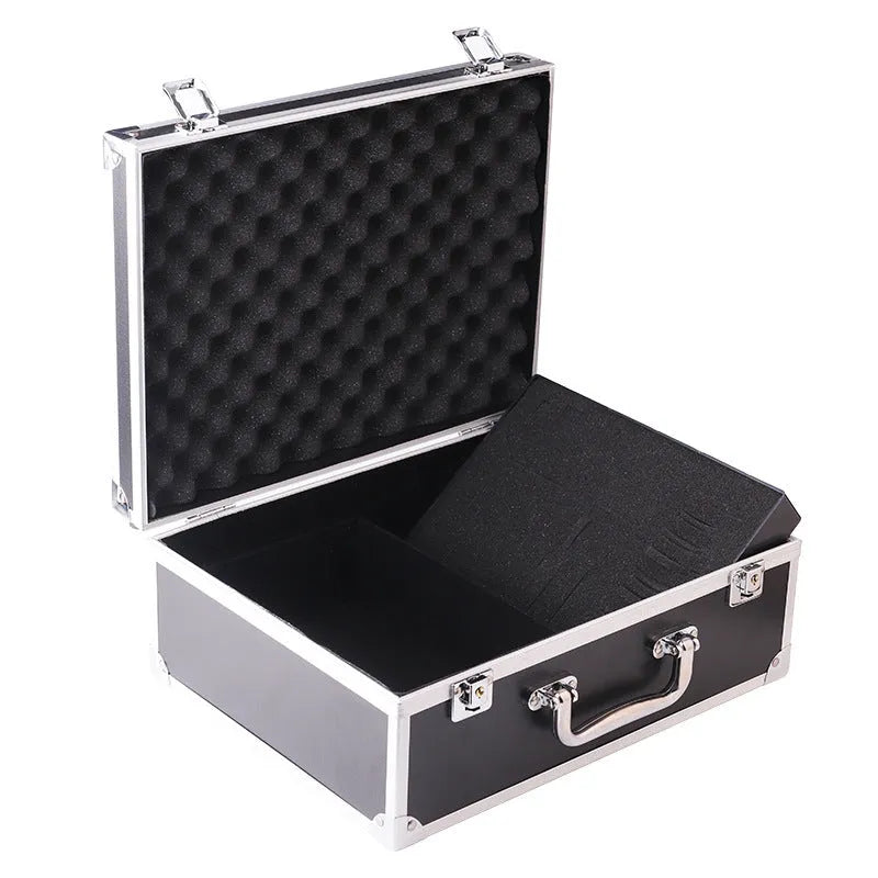 Black aluminium tattoo equipment storage box with foam inserts holding tattoo machines, needles, and ink bottles.