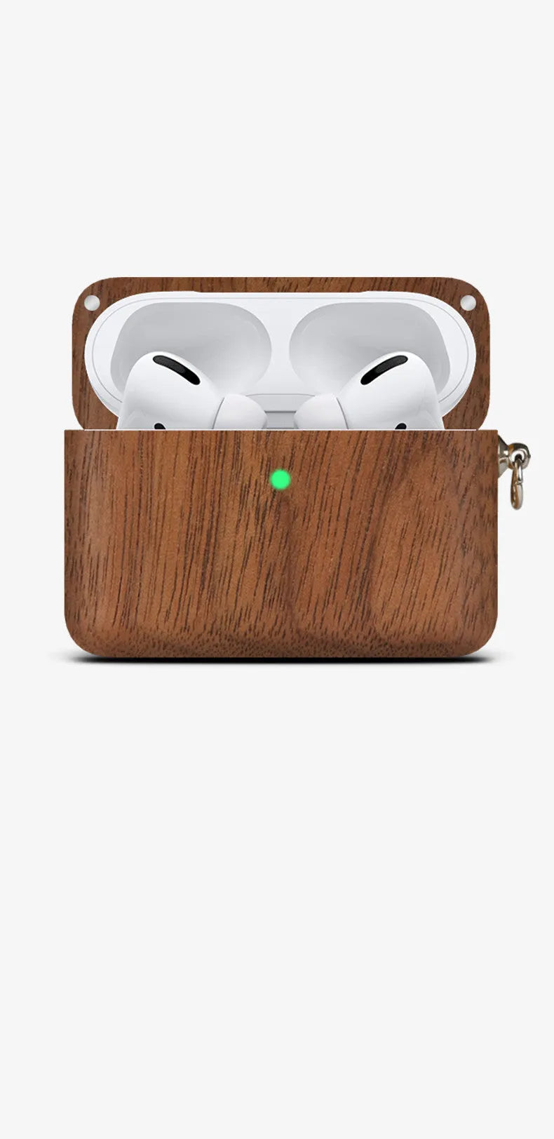Solid wood earphone sleeve in walnut next to compatible wireless earphones on a wooden table.