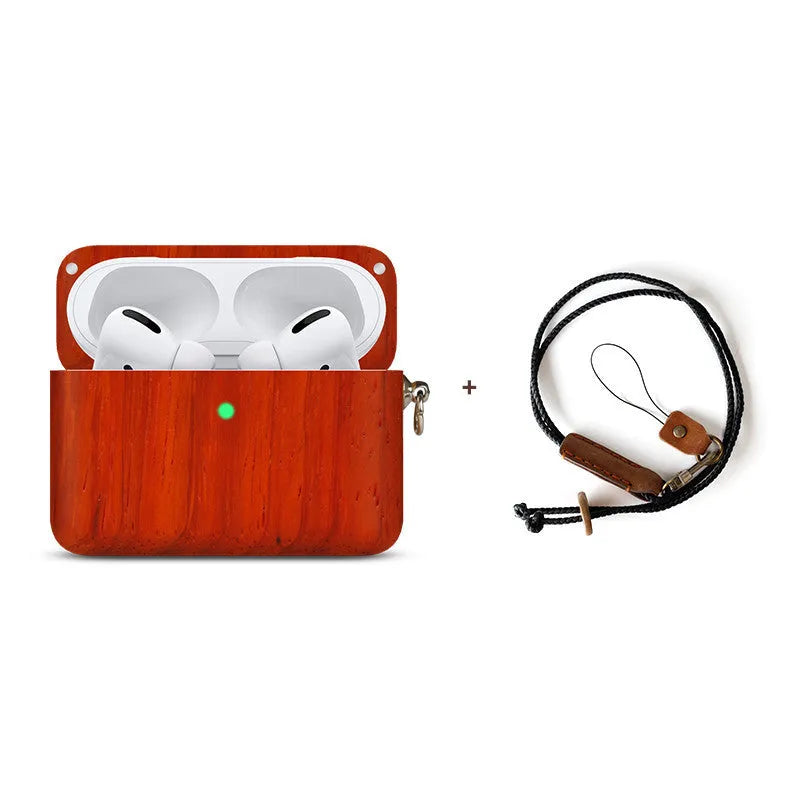 Solid wood earphone sleeve in walnut next to compatible wireless earphones on a wooden table.