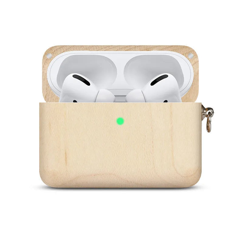 Solid wood earphone sleeve in walnut next to compatible wireless earphones on a wooden table.