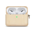 Solid wood earphone sleeve in walnut next to compatible wireless earphones on a wooden table.