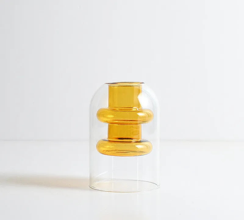 Small colourful double layer blown glass vase for dried flowers, yellow colour option on a table