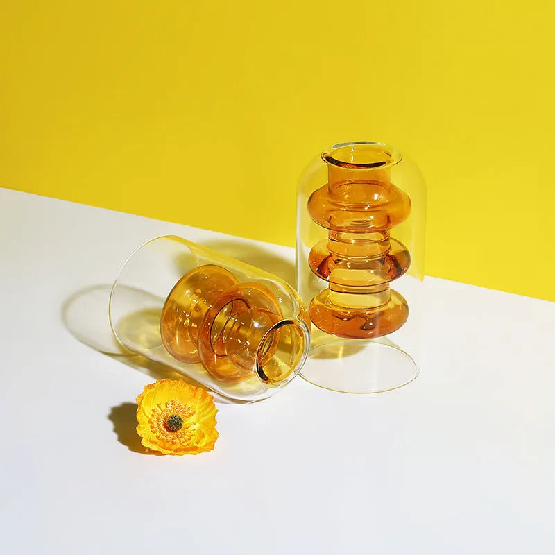 Small colourful double layer blown glass vase for dried flowers, yellow colour option on a table