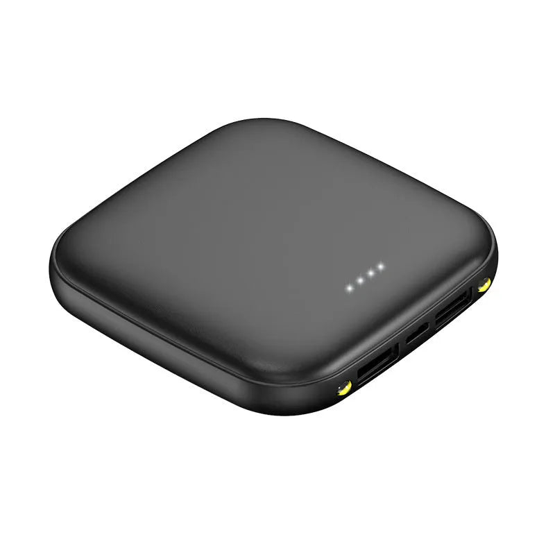 Compact black power bank with LED flashlight, showing scale against a hand.