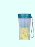 Portable pink electric juicer cup with USB charging cable on kitchen counter