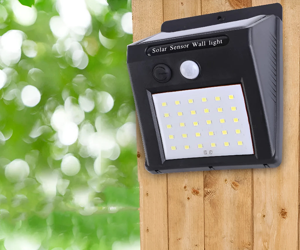 White solar outdoor garden lamp with LED lights and motion sensor for automatic driveway and pathway lighting