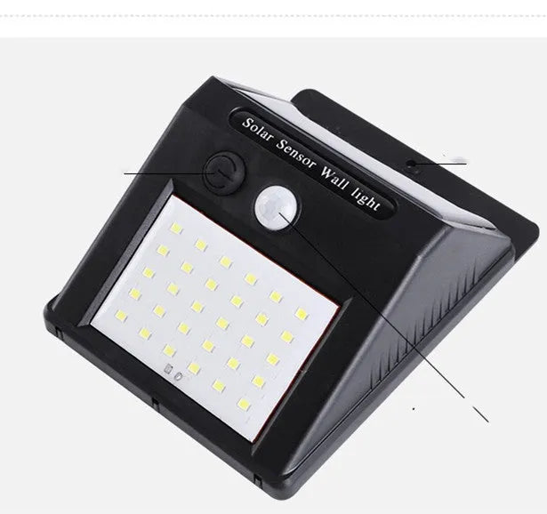 White solar outdoor garden lamp with LED lights and motion sensor for automatic driveway and pathway lighting