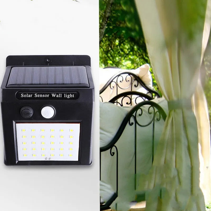 White solar outdoor garden lamp with LED lights and motion sensor for automatic driveway and pathway lighting