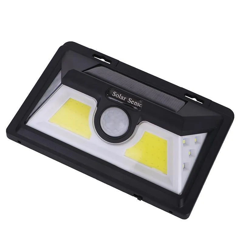 White solar outdoor garden lamp with LED lights and motion sensor for automatic driveway and pathway lighting