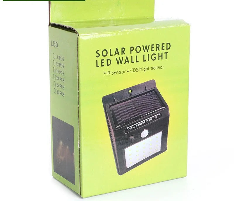 White solar outdoor garden lamp with LED lights and motion sensor for automatic driveway and pathway lighting