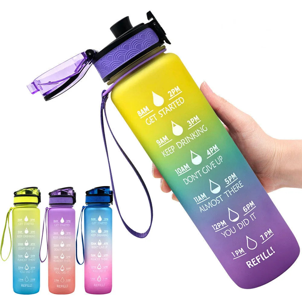 Blue and red gradient 1-litre Tritan sports water bottle with time markers, flip-top lid, and wrist strap.