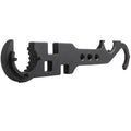 Black multi-function combination wrench for AR-15 and M4 rifles on a plain background.