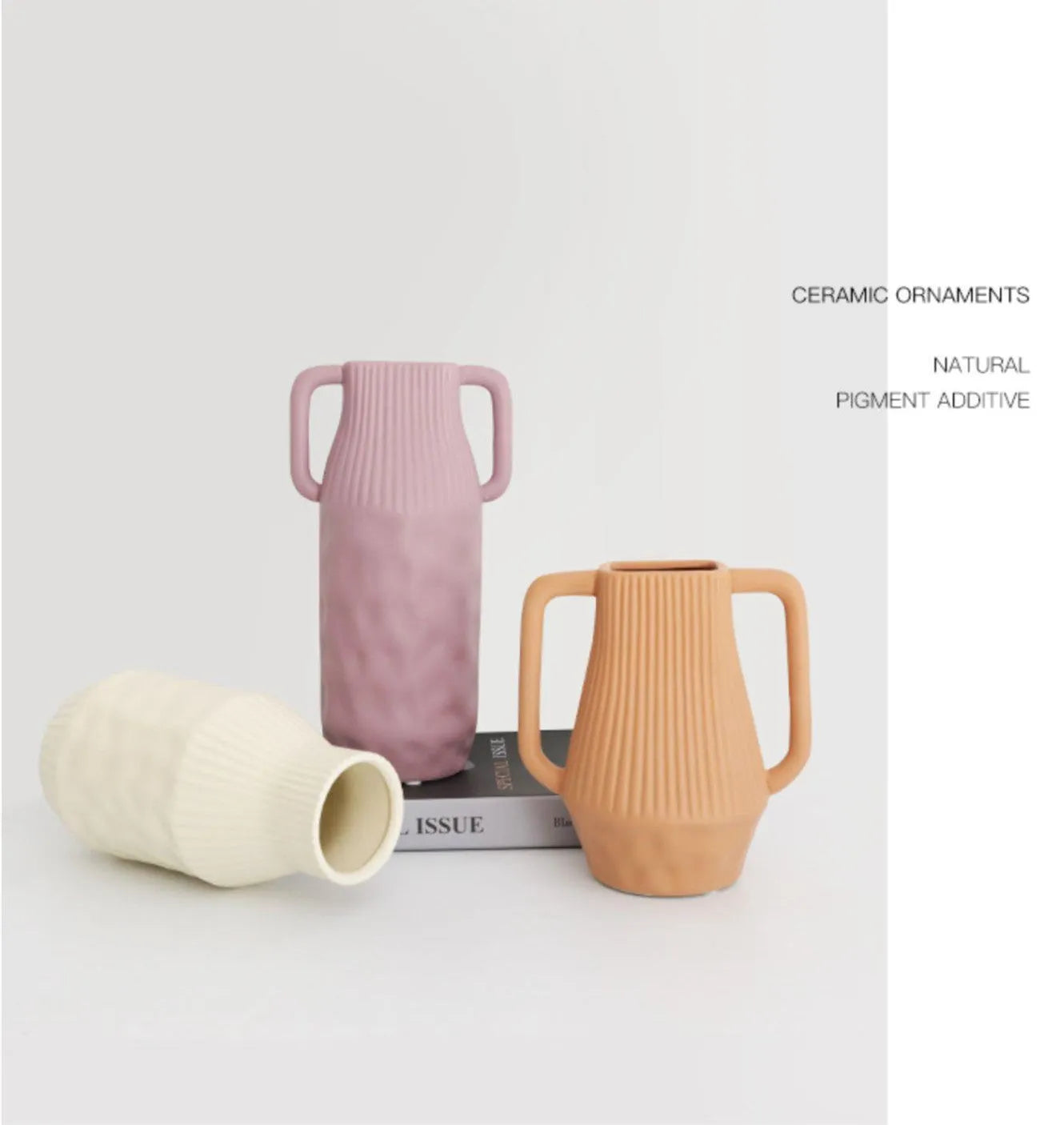 Hand-thrown white ceramic hammer vase in Morandi beige colour on a wooden table.