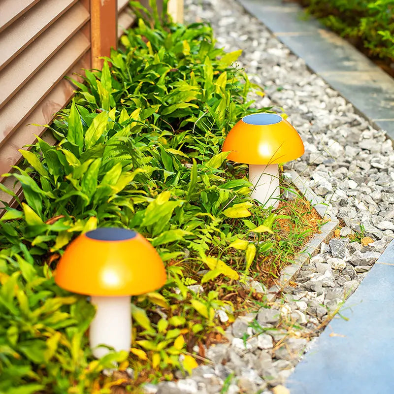 Solar-powered mushroom-shaped ground plug light for garden and lawn decoration.
