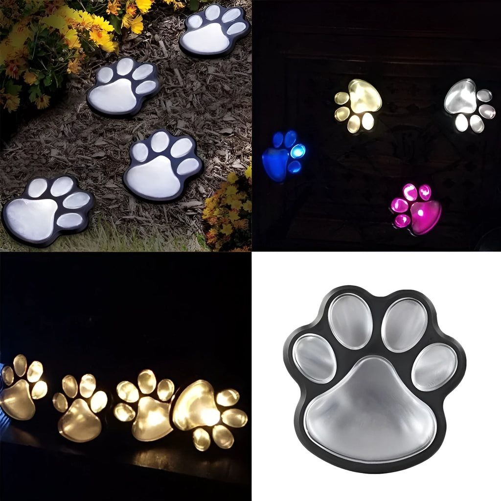 Black solar-powered animal paw print LED garden lights with four paw shapes connected to central solar pole