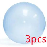 Assortment of inflated pink, yellow, blue and green TPR bouncy balls in different sizes on a plain background.