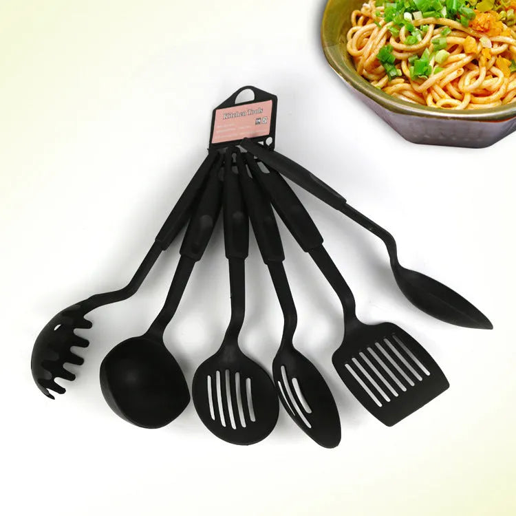 Black rubber kitchen utensil set with shovel spoons for non-stick cookware