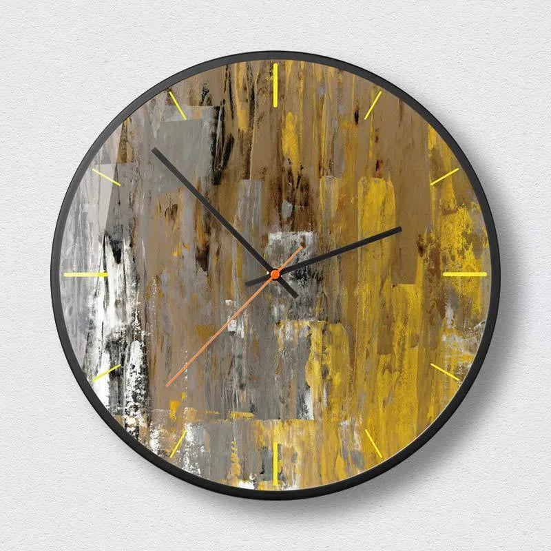 Round abstract art design wall clock with metal frame on a wall.