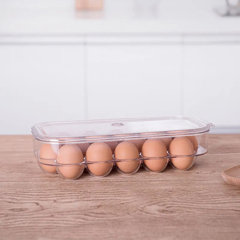 Transparent PET plastic egg storage box measuring 31.4x14.3x7.7cm for refrigerator organisation