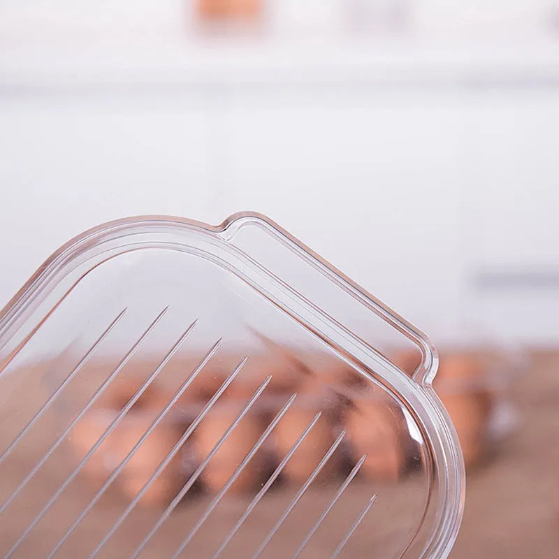 Transparent PET plastic egg storage box measuring 31.4x14.3x7.7cm for refrigerator organisation