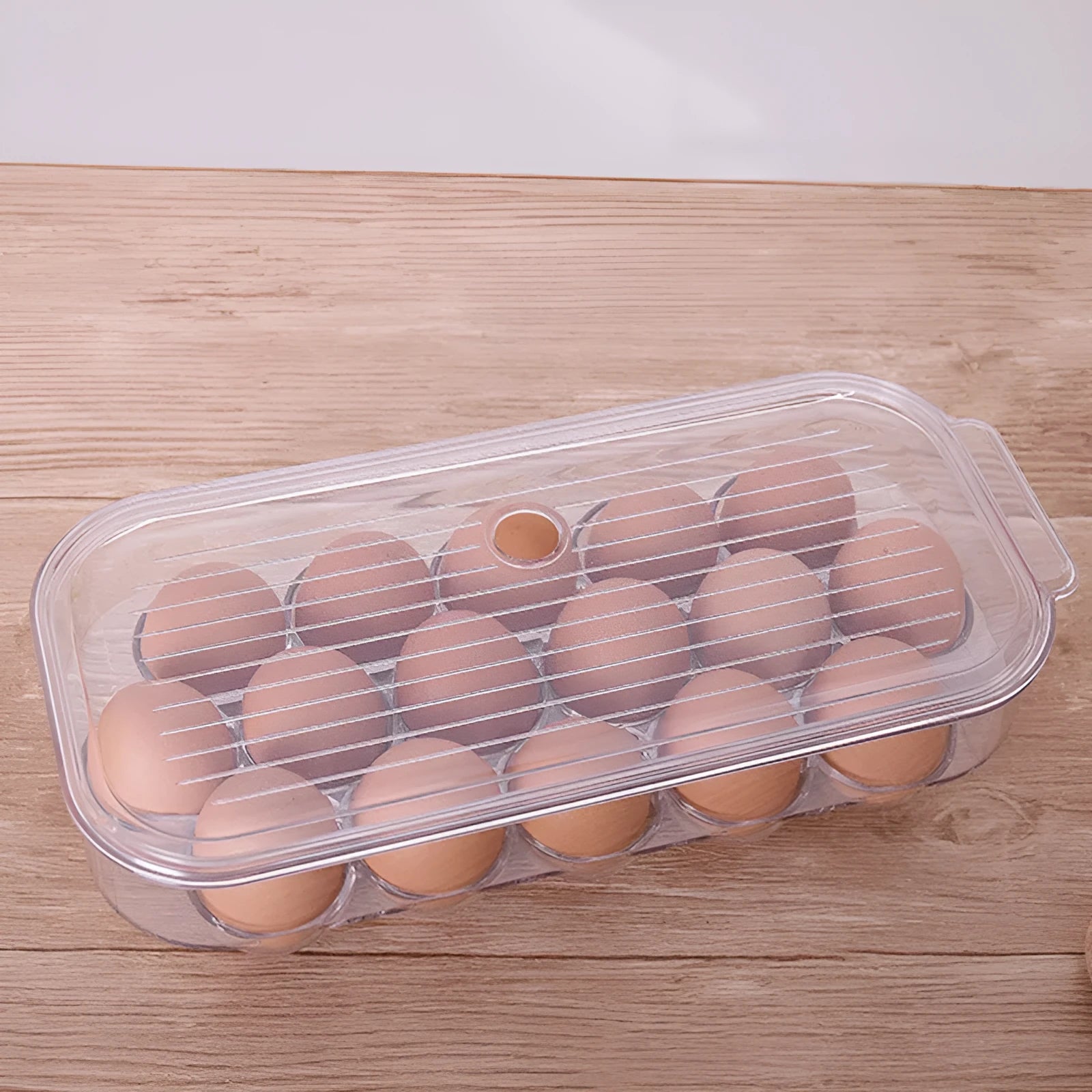 Transparent PET plastic egg storage box measuring 31.4x14.3x7.7cm for refrigerator organisation