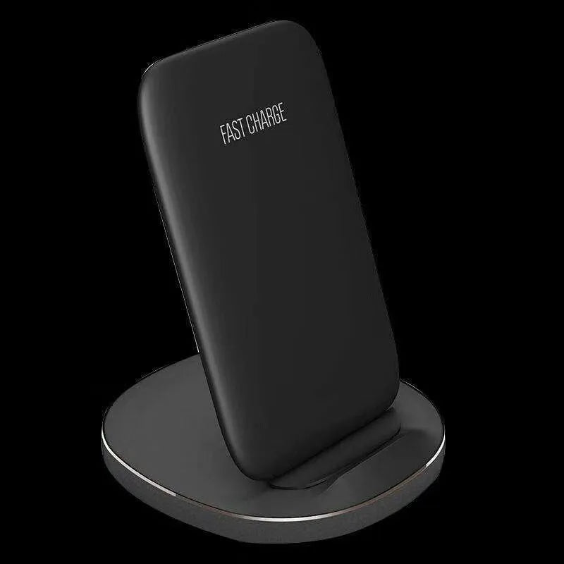 Vertical wireless charging dock in black colour charging smartphone upright on desk