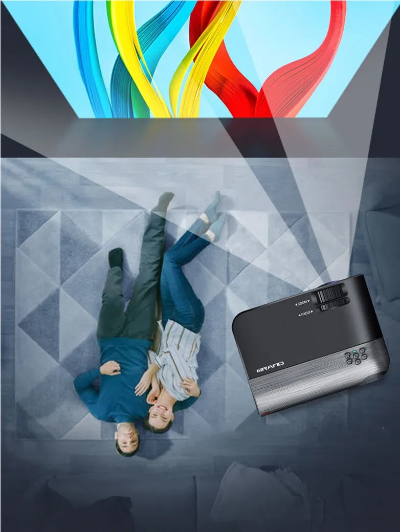 Compact portable WiFi projector for smartphones with remote control on a table.