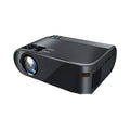Compact portable WiFi projector for smartphones with remote control on a table.