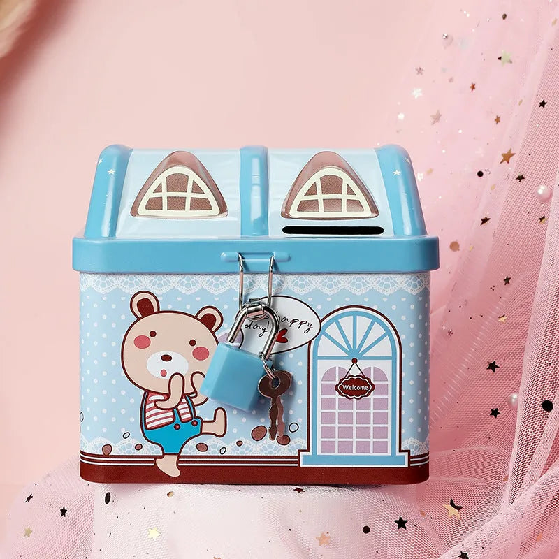 Blue house-shaped tinplate piggy bank on desktop for coin storage