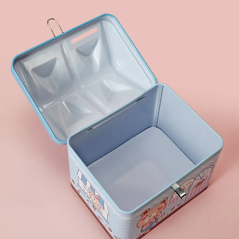 Blue house-shaped tinplate piggy bank on desktop for coin storage
