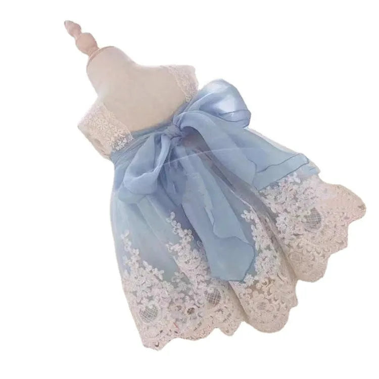 Ocean Blue baby girl princess dress with lace detailing on a hanger