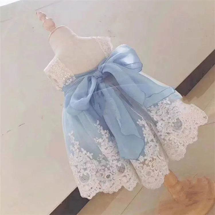 Ocean Blue baby girl princess dress with lace detailing on a hanger