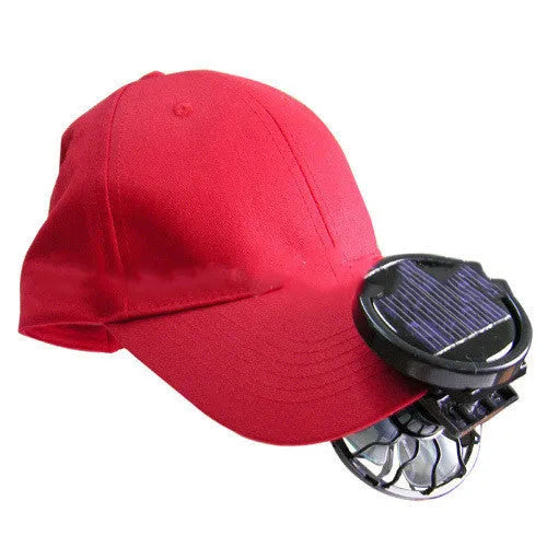 Black portable solar fan panel with clip, shown in an outdoor setting.
