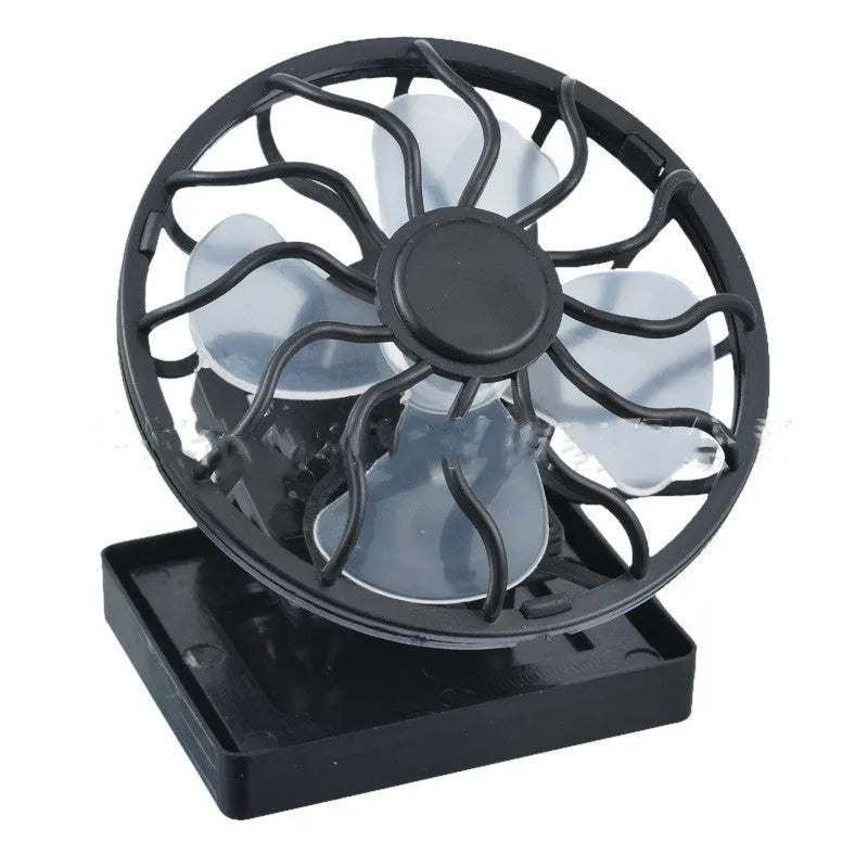 Black portable solar fan panel with clip, shown in an outdoor setting.