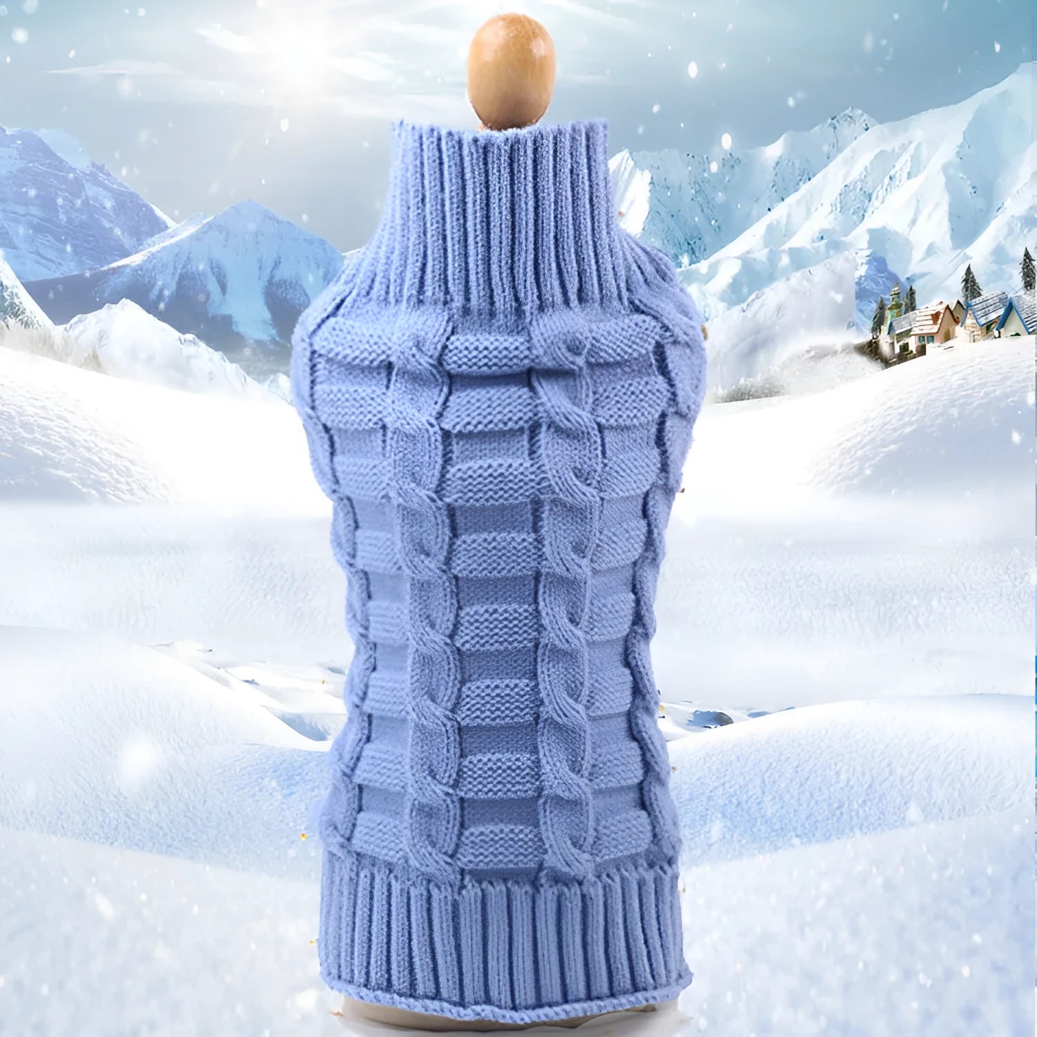 A blue cashmere wool dog sweater with a twisted rope design laid flat, showing its size and shape.