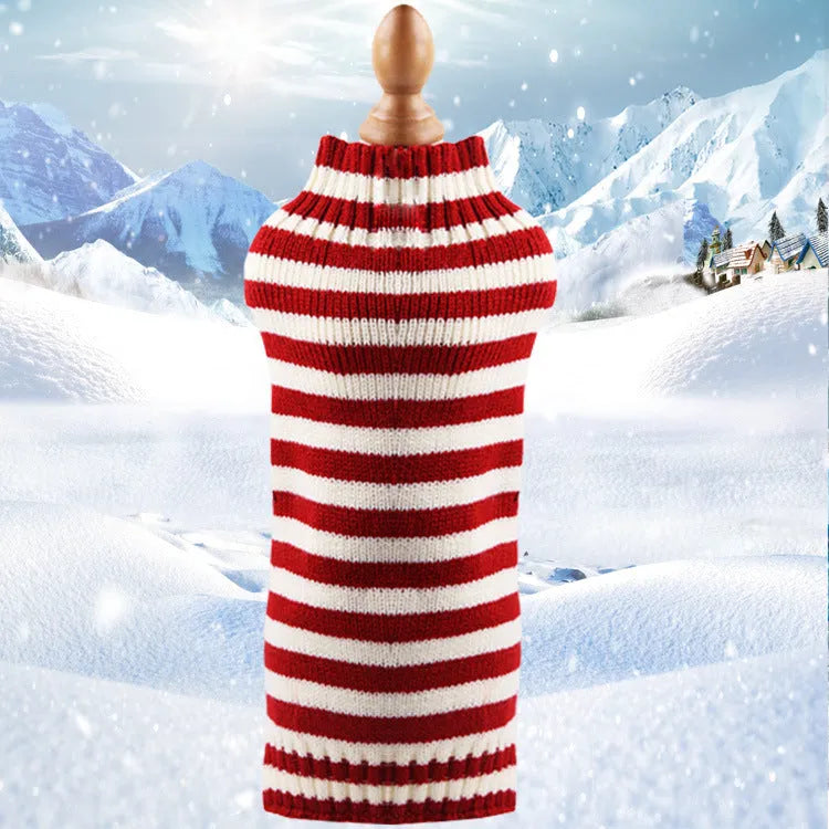 A blue cashmere wool dog sweater with a twisted rope design laid flat, showing its size and shape.