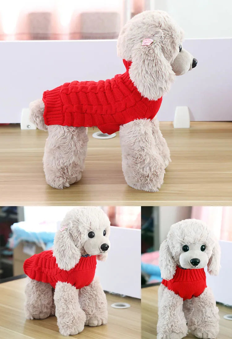 A blue cashmere wool dog sweater with a twisted rope design laid flat, showing its size and shape.