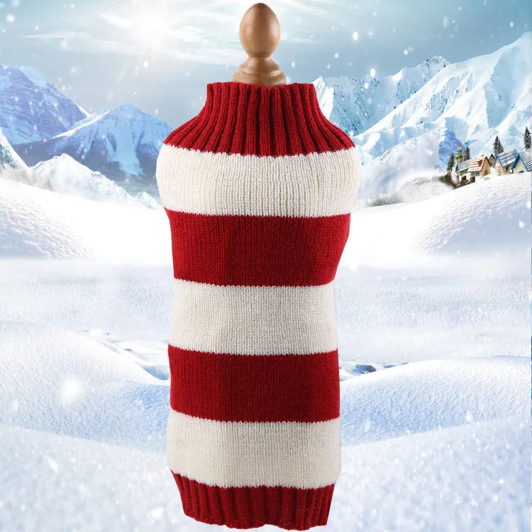A blue cashmere wool dog sweater with a twisted rope design laid flat, showing its size and shape.