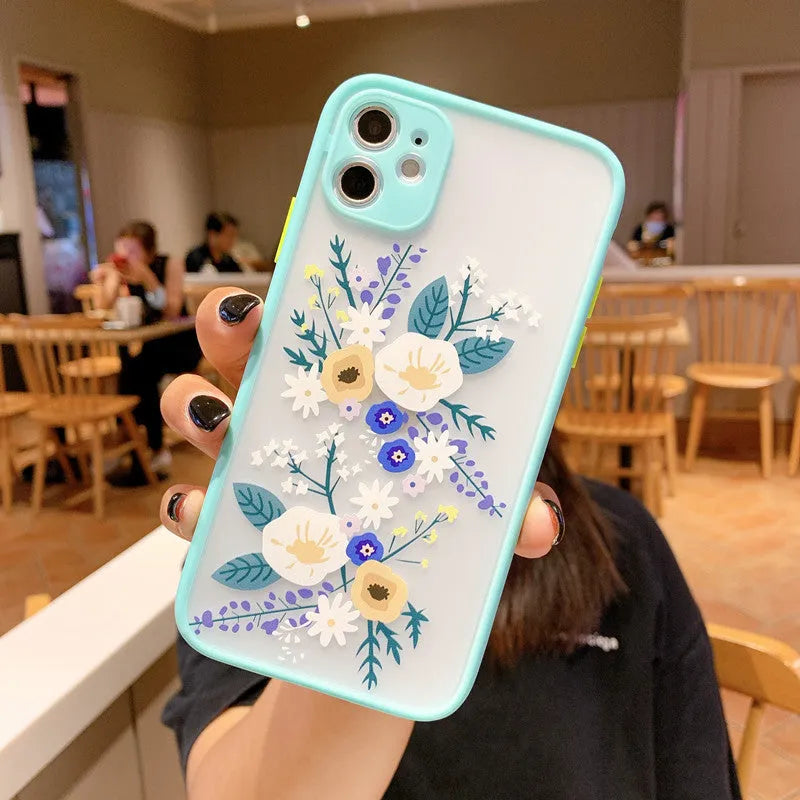 Contrasting colour matte frame iPhone case with painted cartoon floral design in blue flower colourway