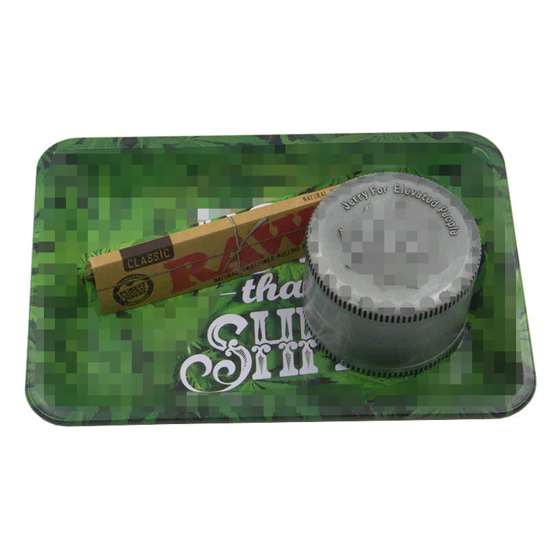 Green metal cigarette tray with maple leaf pattern, 18 x 12.5 cm tinplate ashtray on table