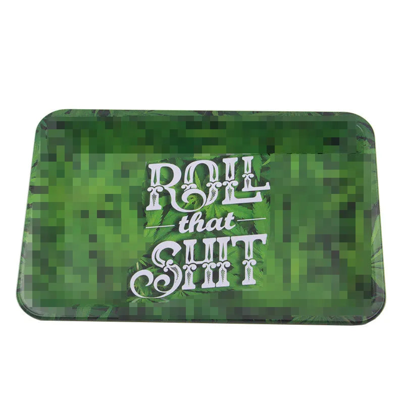 Green metal cigarette tray with maple leaf pattern, 18 x 12.5 cm tinplate ashtray on table