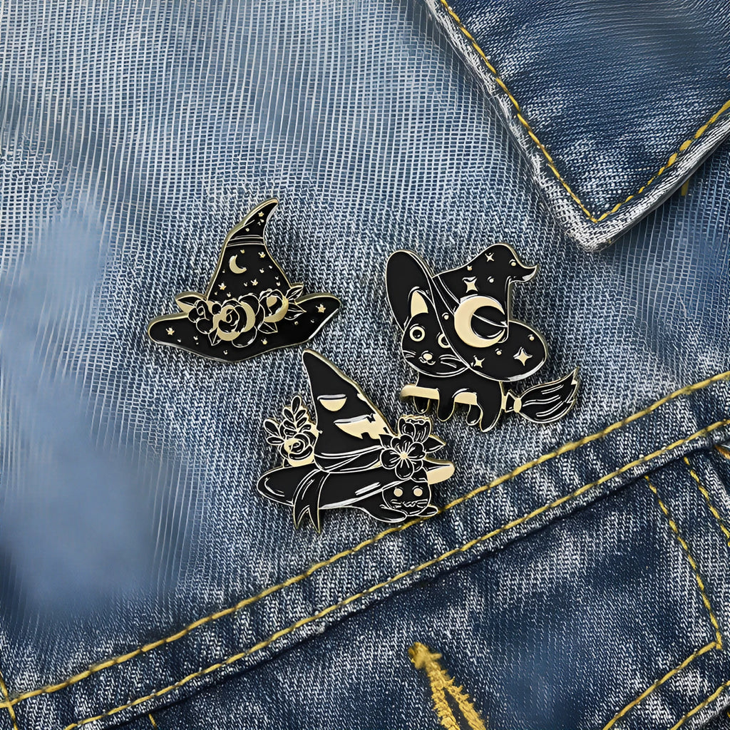 Punk black magic cat brooch with wizard hat design in alloy with baking varnish finish on white background.