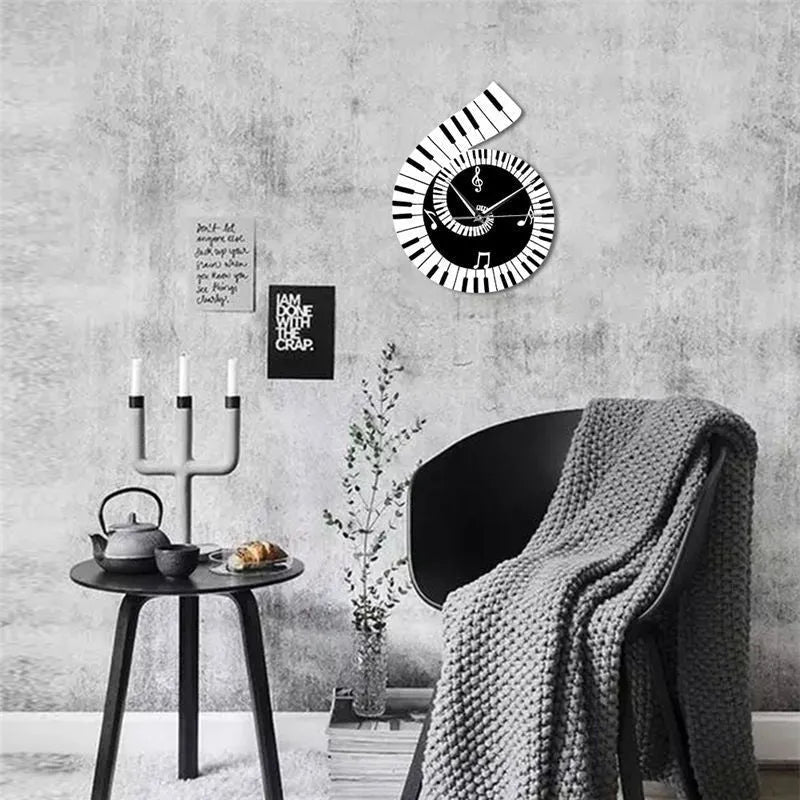 Black and white treble clef shaped wall clock with piano keyboard design and musical notes