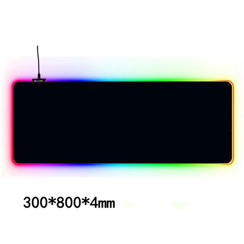 Large RGB gaming mouse pad with colourful seaming and waterproof cloth surface on a desk