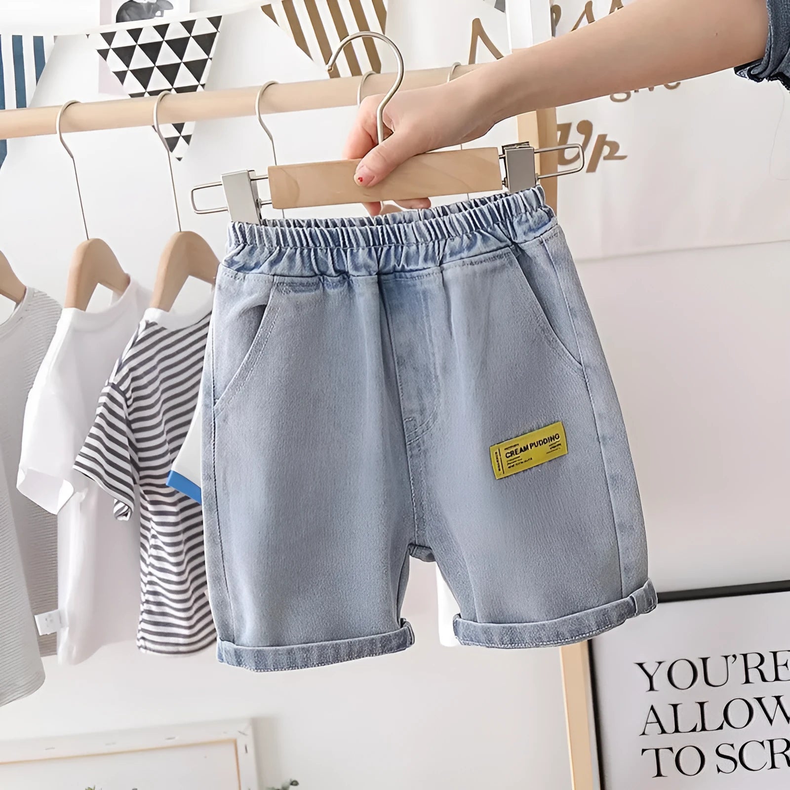 Baby boy cotton denim shorts in blue milk pudding style showing front view