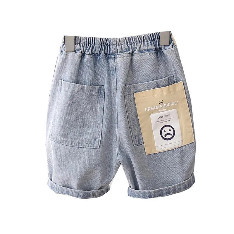 Baby boy cotton denim shorts in blue milk pudding style showing front view