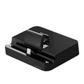 Black base USB-C mobile phone to HD display dock converter unit on a desk