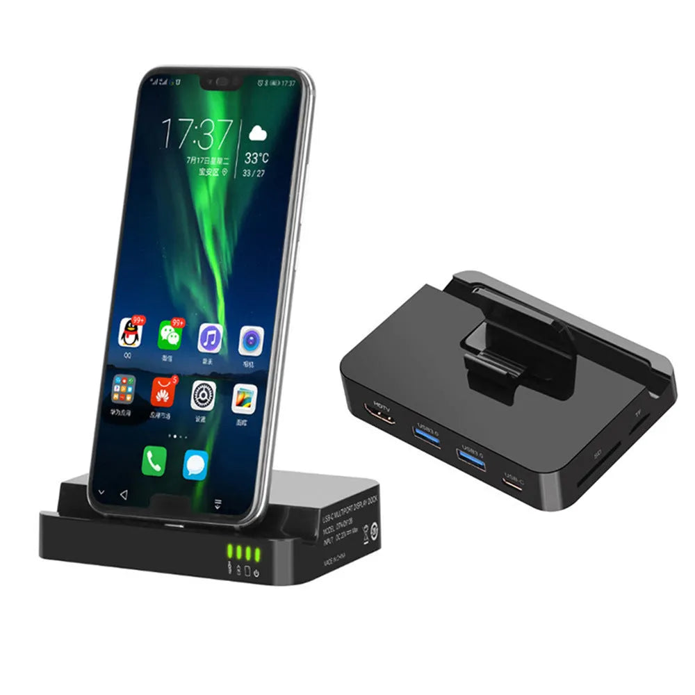 Black base USB-C mobile phone to HD display dock converter unit on a desk