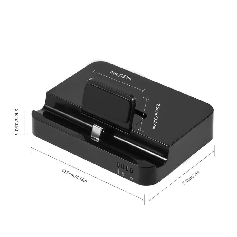Black base USB-C mobile phone to HD display dock converter unit on a desk
