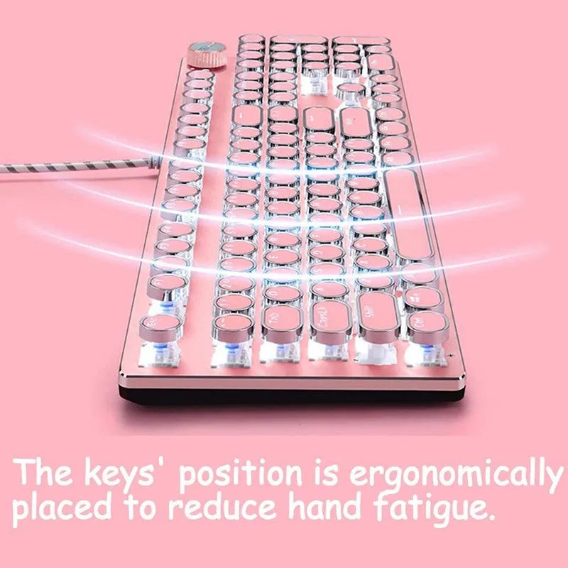 Queen Lipstick mechanical keyboard with green switches, white backlight, silver and pink casing on a desk.